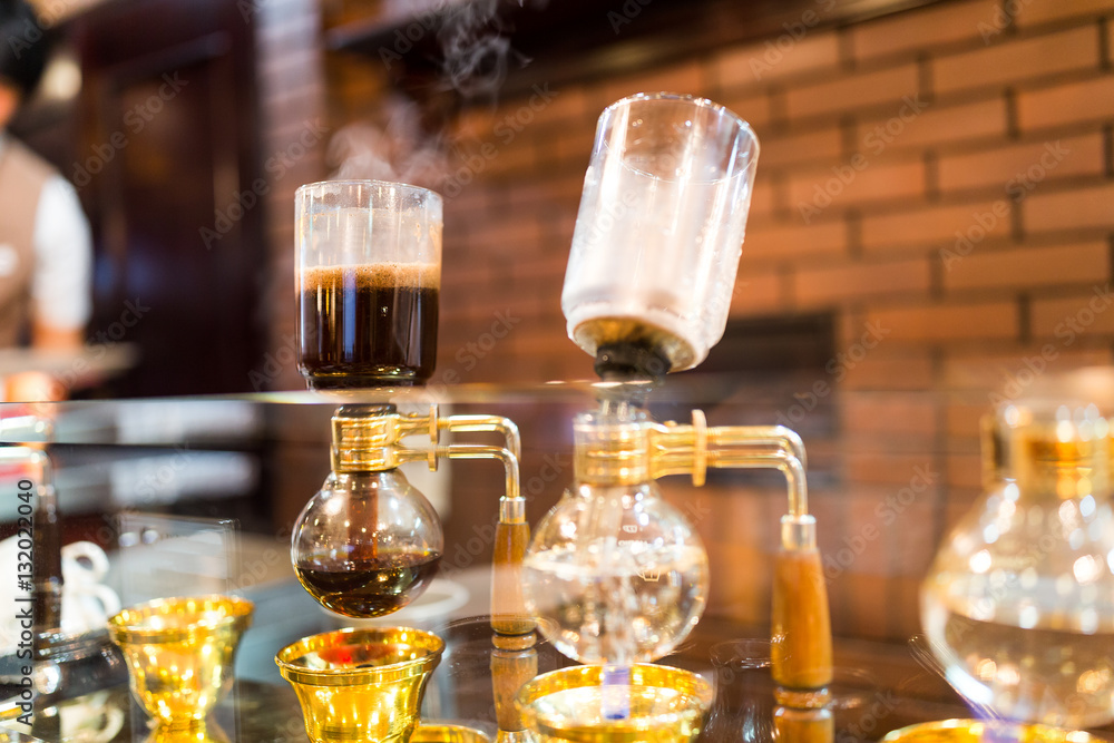 Siphon vacuum coffee maker on cafe bar Siphon vacuum coffee maker on cafe bar