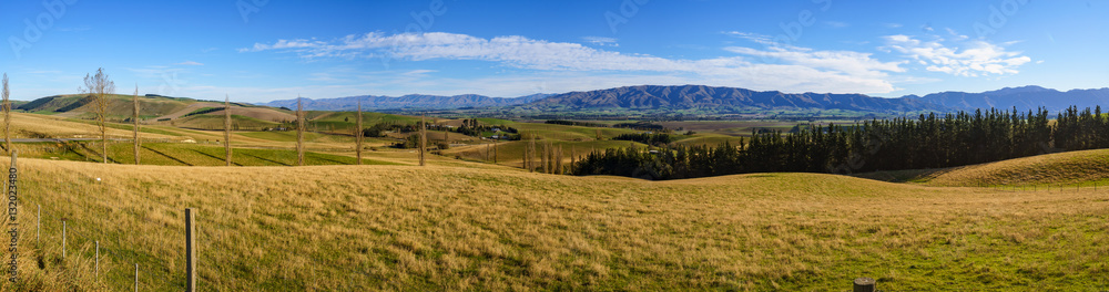 Panorama Scenic View Of Hilly Green Pasture. Canterbury, New Zea Panorama Scenic View Of Hilly Green Pasture. Canterbury, New Zea