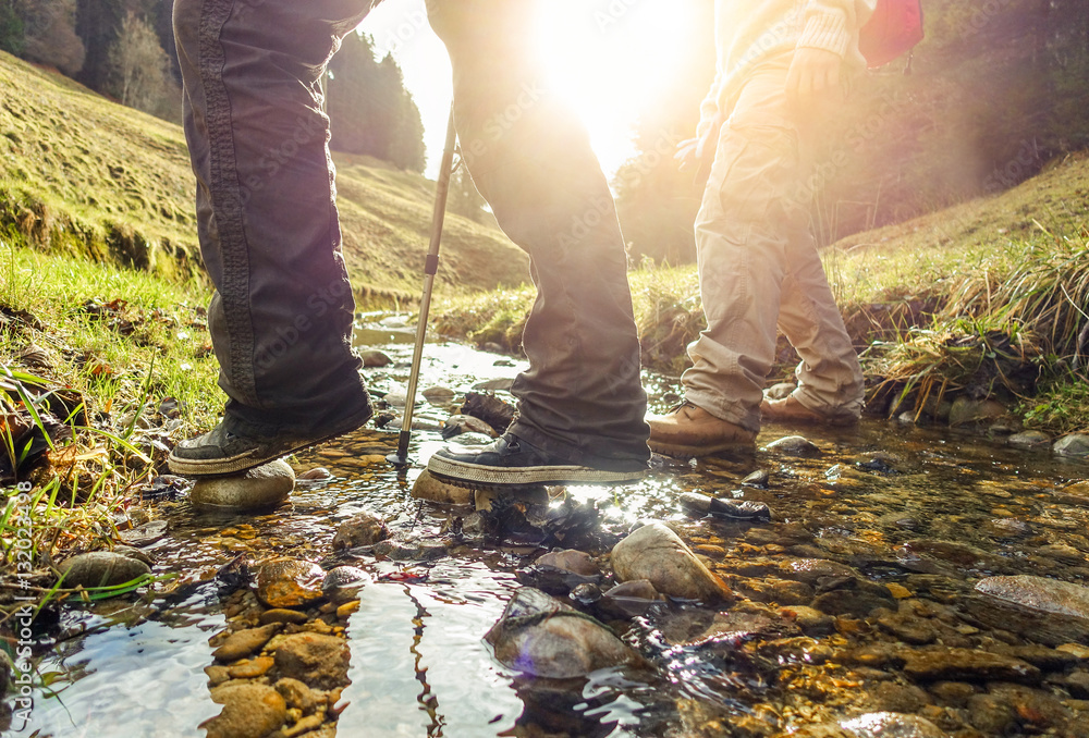 Obraz premium Two friends doing trekking in switzerland mountains in summer