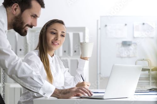 Bearded man and a woman at work