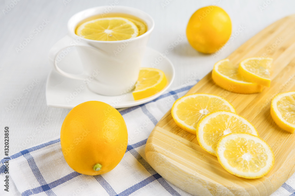 Lemons and tea on a light background Lemons and tea on a light background