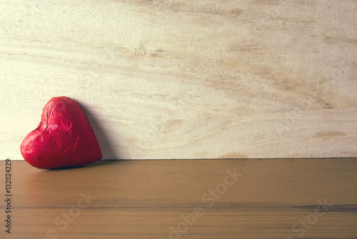 red heart with wood wall