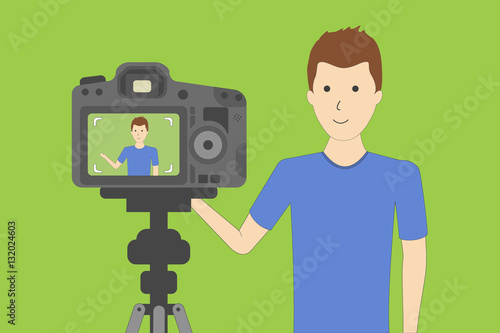Studio blog recording on chroma key background. Vlog. Video recording. Handsome boy.