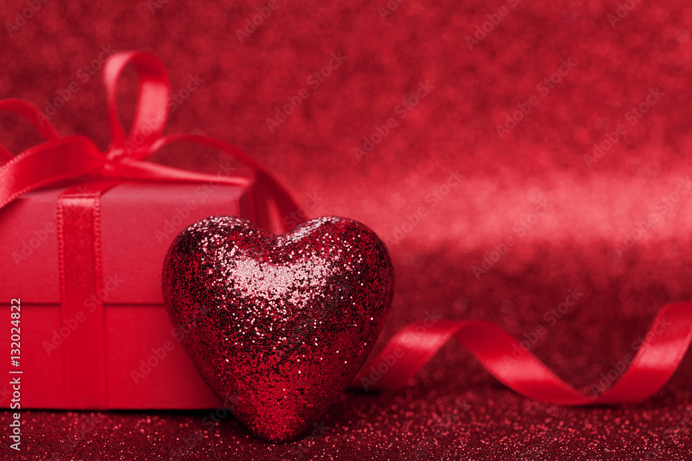 Gift or present box with red bow ribbon and heart on sparkling background for Valentines day. Gift or present box with red bow ribbon and heart on sparkling background for Valentines day.