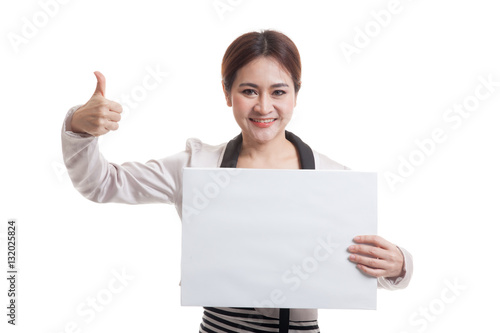 Young Asian business woman show thumbs up with white blank sign