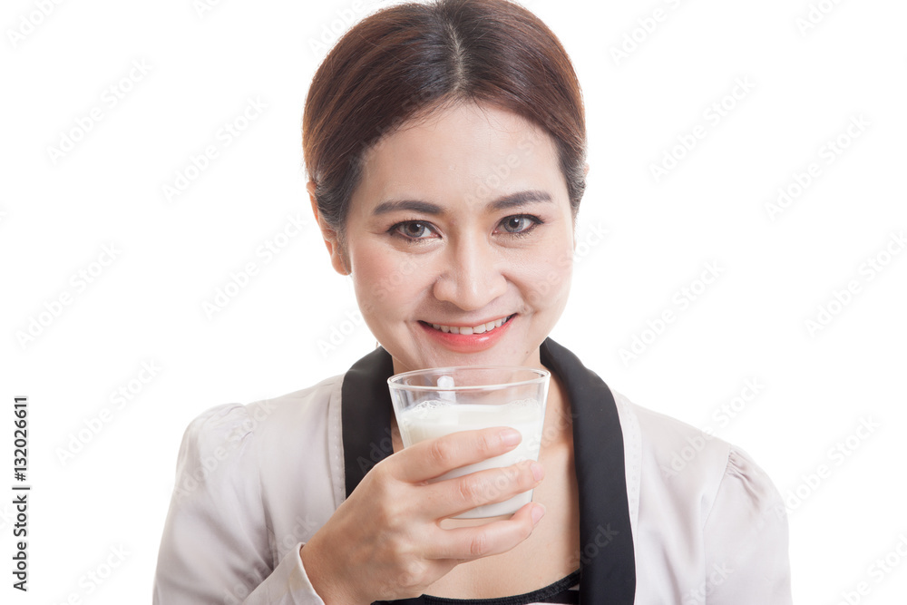 Healthy Asian woman drinking a glass of milk. Healthy Asian woman drinking a glass of milk.