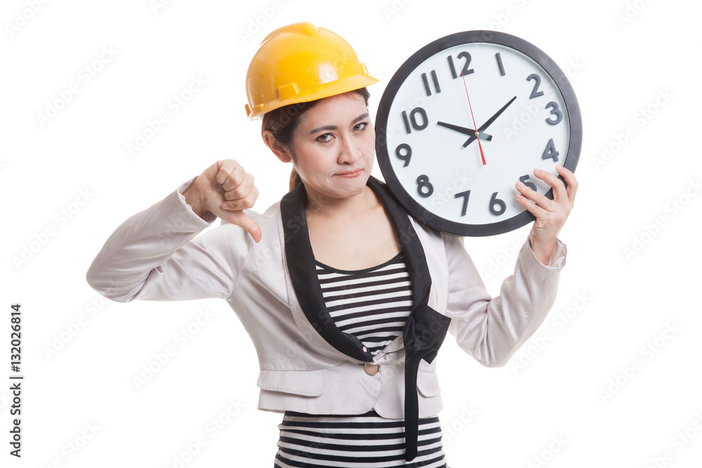 Asian engineer woman thumbs down with a clock. Asian engineer woman thumbs down with a clock.