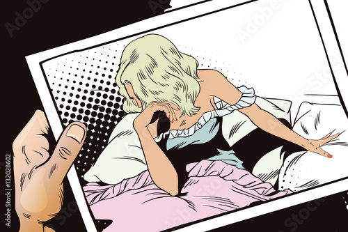 Sad girl in bed. Hand with photo.