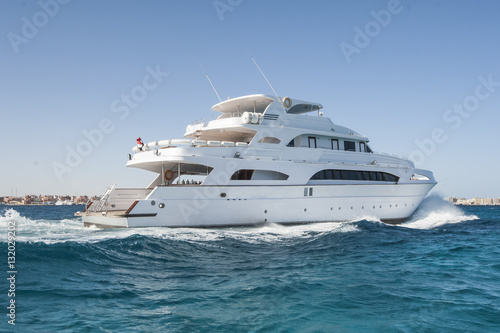 Large private motor yacht out at sea