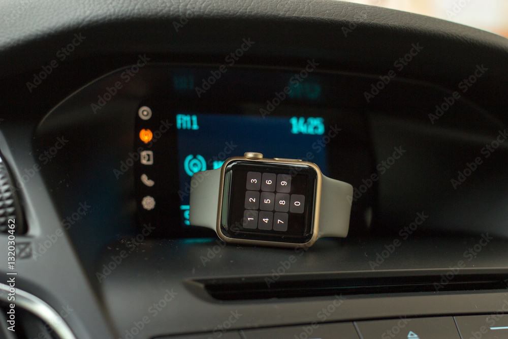 Smart watch on car dashboard
