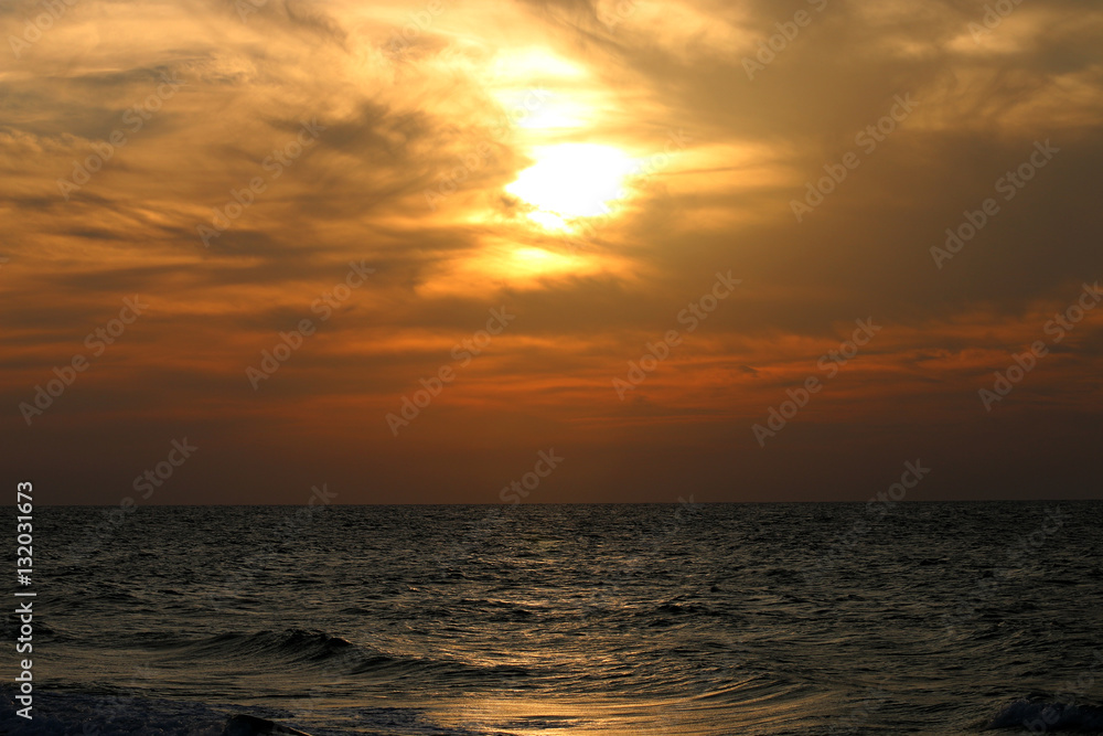 Very beautiful sunset in winter, cloudy sky, sun ray in the sea of clouds