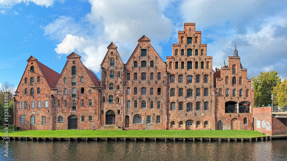 Naklejka premium Salzspeicher (salt storehouses), six historic brick buildings on the Upper Trave River in Lubeck, Germany