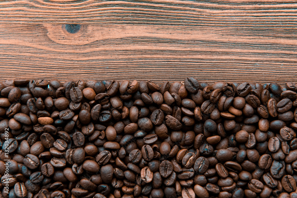 Coffee beans on wood background Coffee beans on wood background