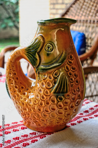 Fish shaped water pitcher on a table photo