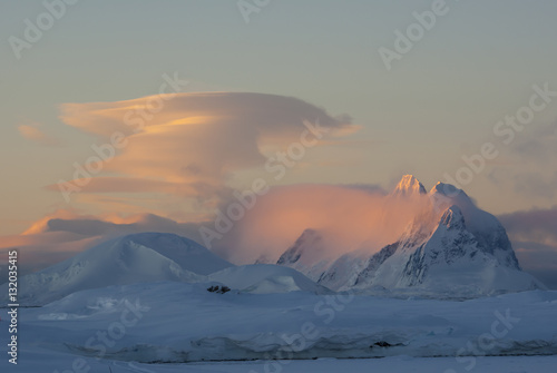 lenticular cloud at sunset over the mountains of the Antarctic P