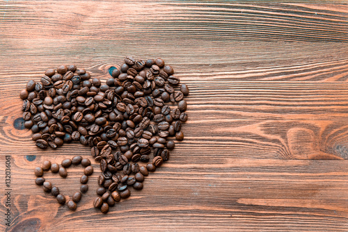 Coffee beans, grain two hearts on background of wooden , bagging. Valentine's Day or Wedding, love, black, frame. Big and small heart