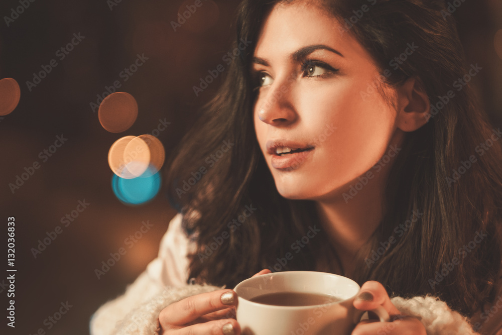 Fototapeta premium Portrait of beautiful young woman with cup of tea