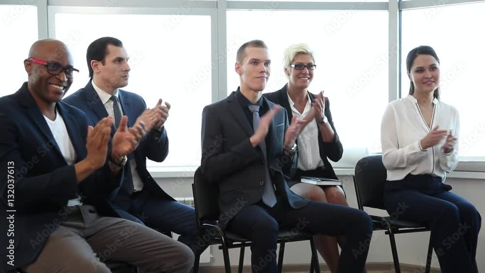 Successful Presentation of the Business Project/A group of businessmen is located in the conference room. They listened to the speech of one of his colleagues Successful Presentation of the Business Project/A group of businessmen is located in the conference room. They listened to the speech of one of his colleagues
