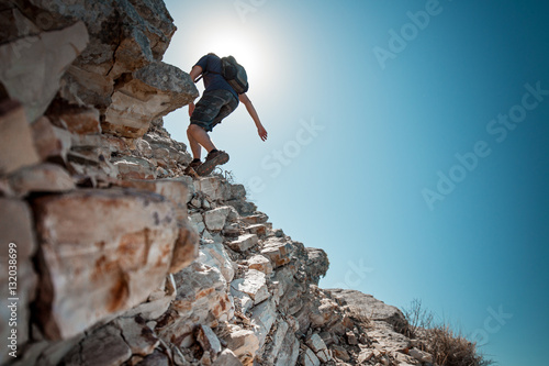 Tableau sur toile Hiker crossing rocky terrain in the Bryce Canyon National Park, USA