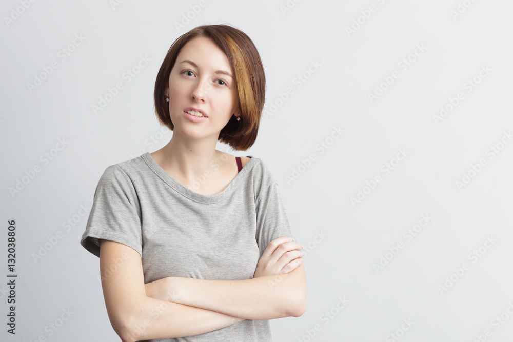 Beautiful and skinny girl with displeasure crossed her arms over Beautiful and skinny girl with displeasure crossed her arms over