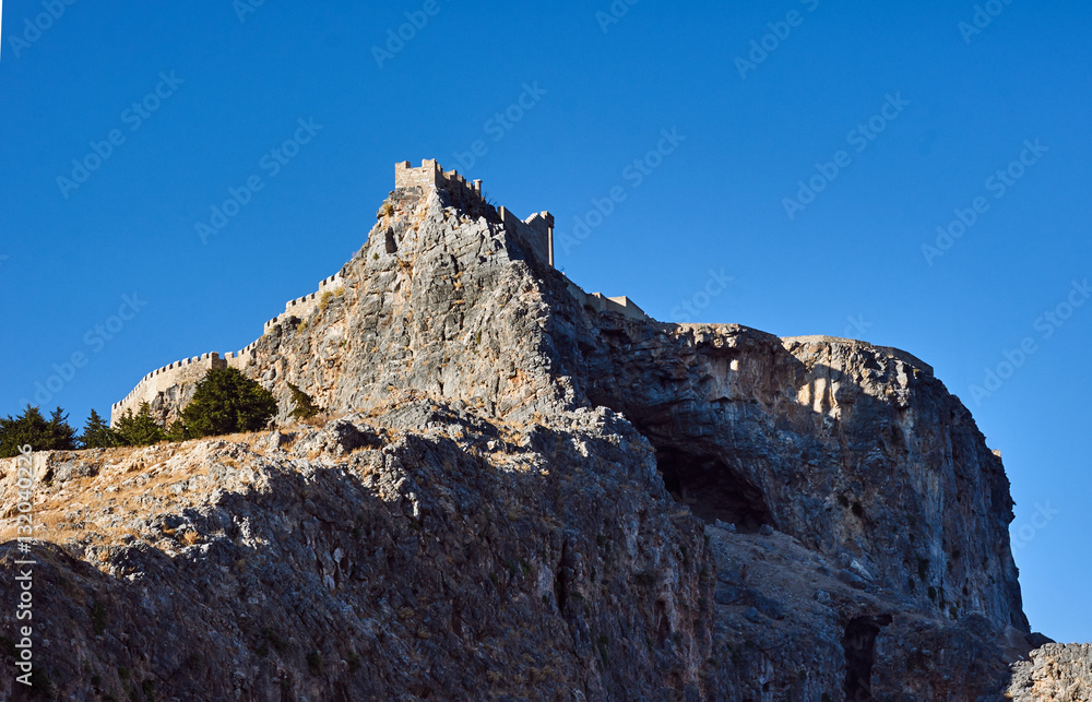 Medieval fortifications on top of the rock in Lindos . Medieval fortifications on top of the rock in Lindos .