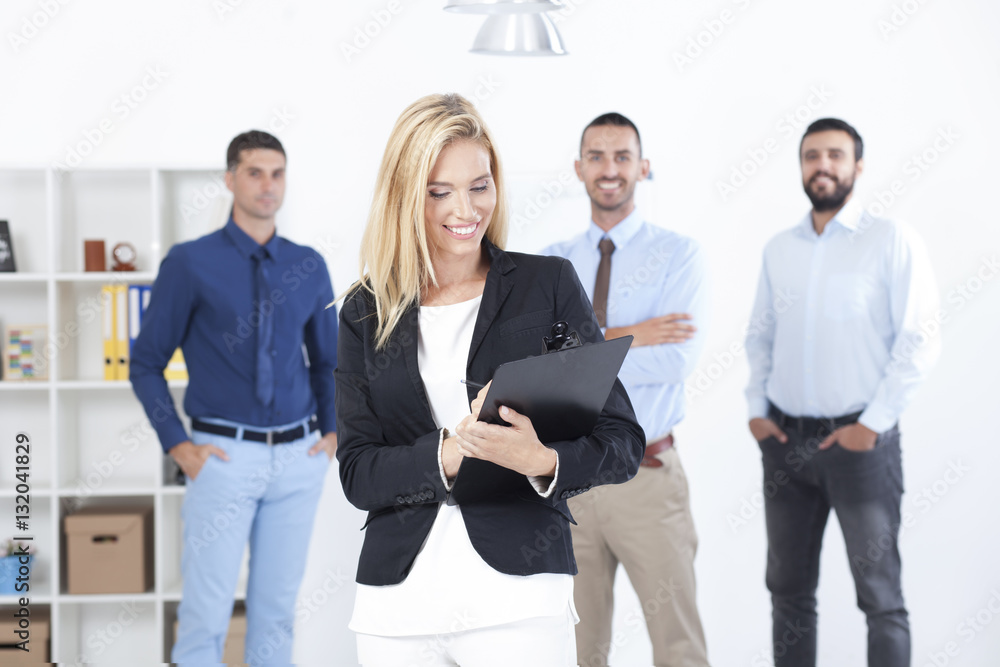 Portrait Of Young Businesswoman With Business Team Portrait Of Young Businesswoman With Business Team