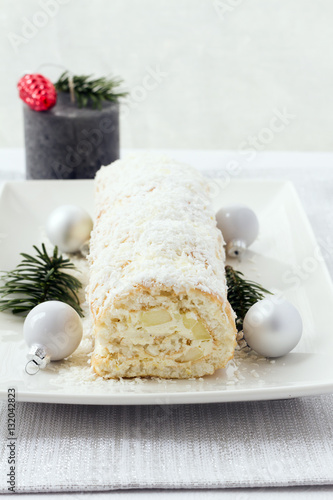 Rolled christmas cake with cocoanut and apples, bûche de noël blanche. 