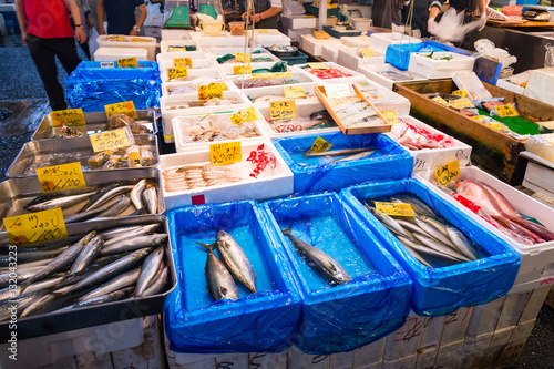 Shoppers visit Stalls selling fish in the tsukiji fish market i