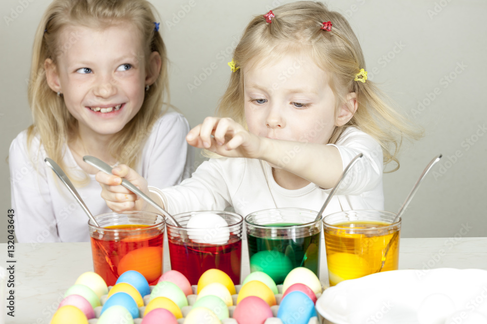 little girls during Easter eggs'' coloration little girls during Easter eggs'' coloration