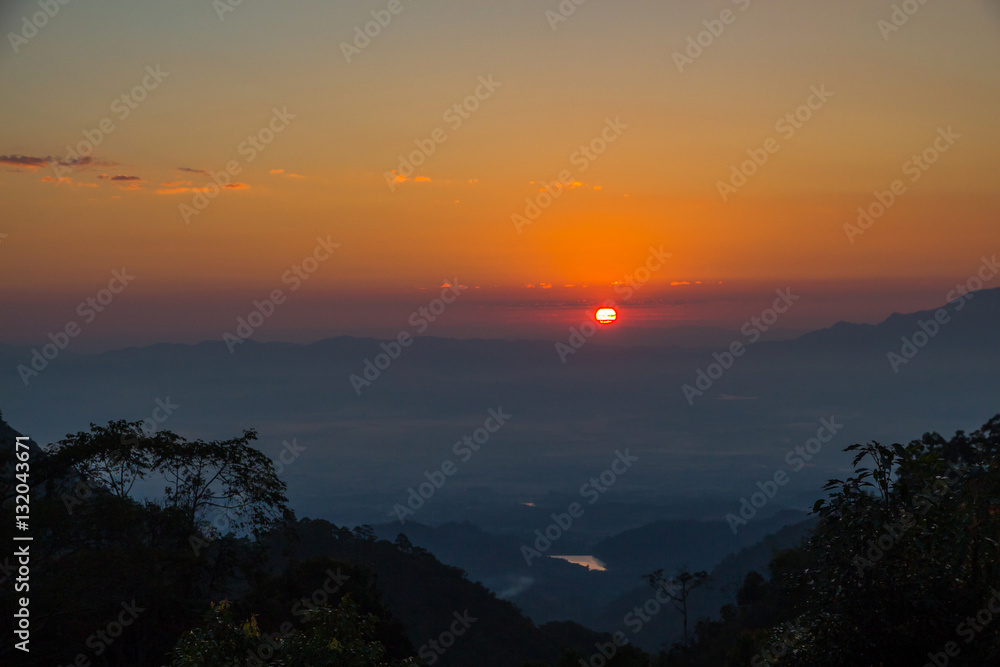 Landscape of sunrise over misty mountains in the morning at Chia