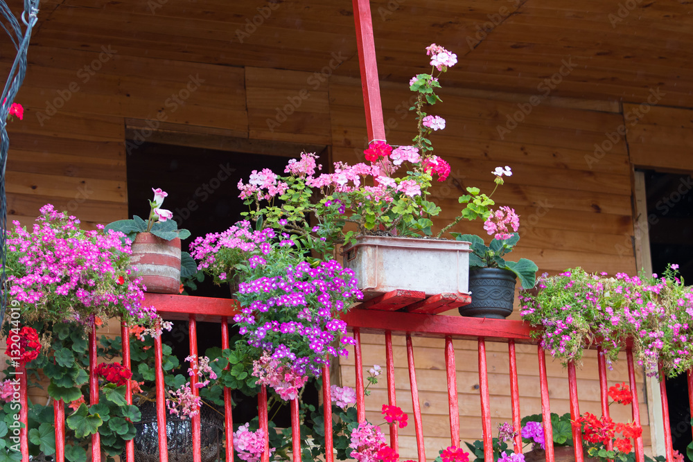 Fototapeta premium rustic balcony with flowers