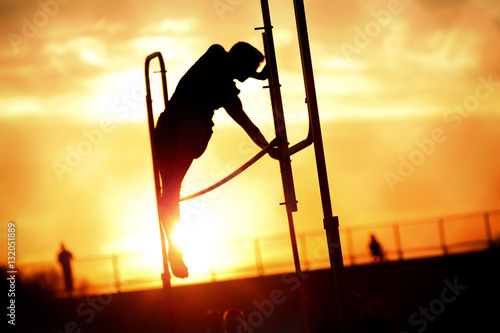 Pole Vaulter at sunset photo