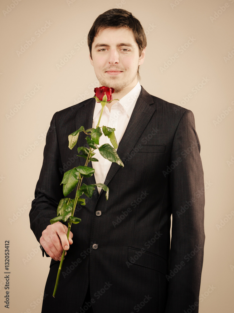 Elegant young man with red rose. Elegant young man with red rose.