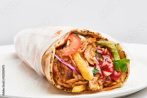 shawarma with sauce on white background..