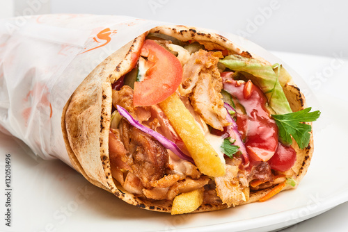 shawarma with sauce on white background.. photo