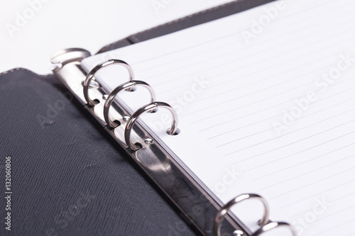 Wallpaper Mural Loop black leather book on white background. Torontodigital.ca