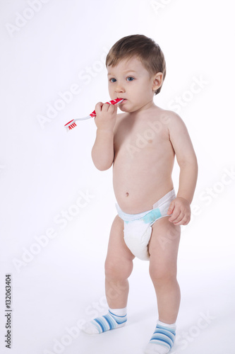little boy brushing his teeth
