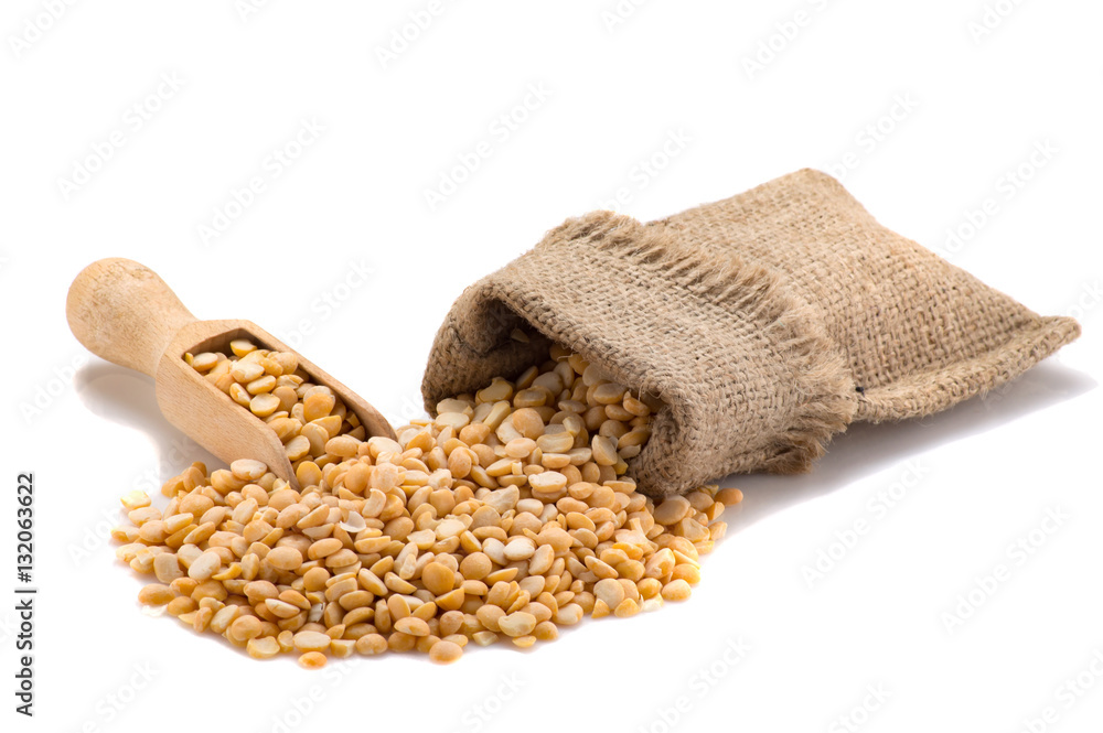 Yellow peas in a burlap with a shovel