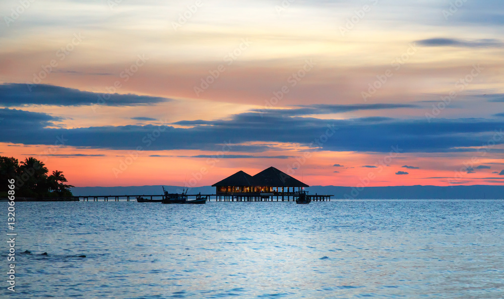 Water cafe at sunset - Maldives vacation background Water cafe at sunset - Maldives vacation background