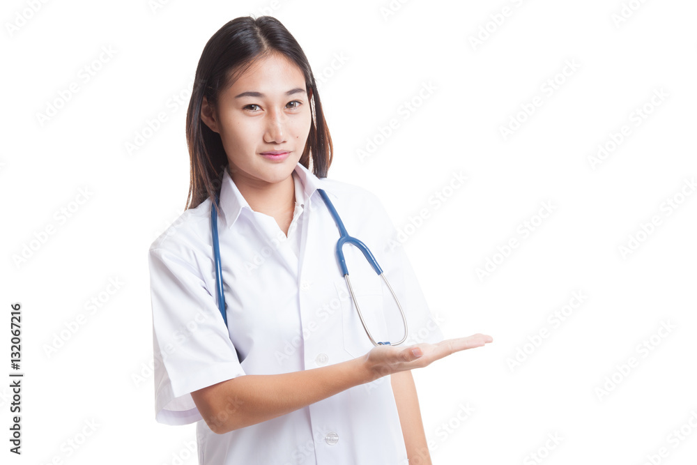 Asian young female doctor present something on her left. Asian young female doctor present something on her left.