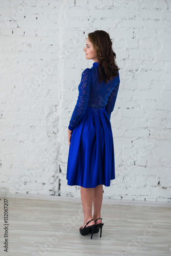 woman posing in blue evening dress © familylifestyle