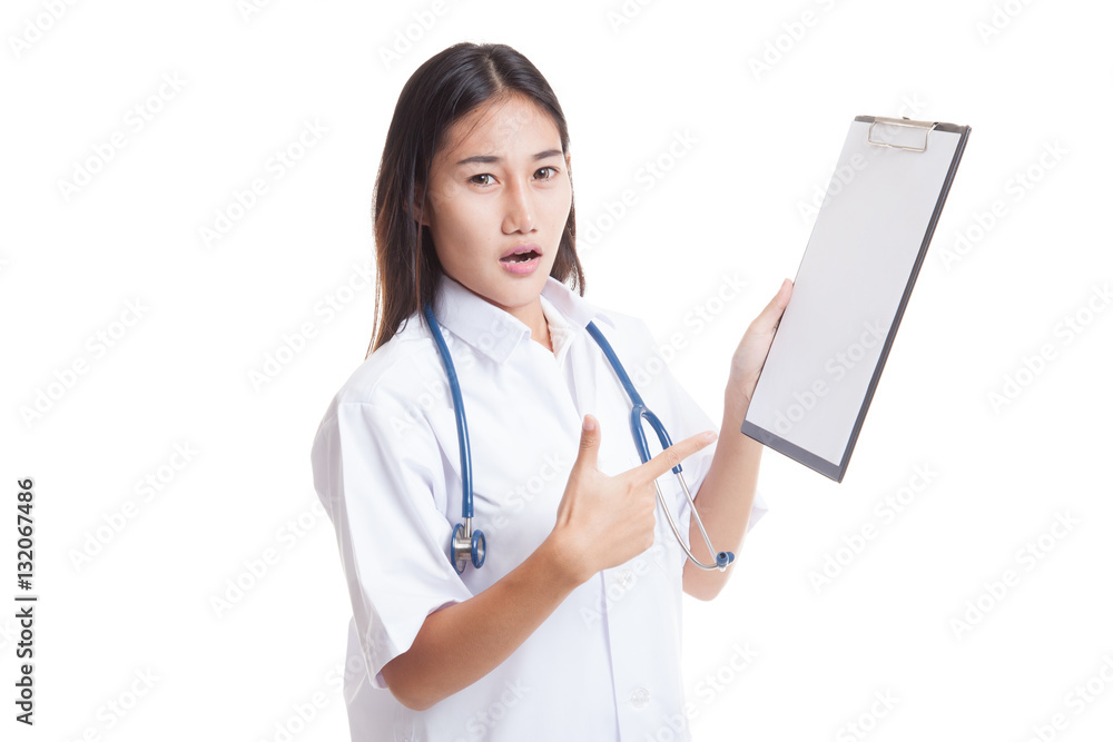 Angry Asian young female doctor point to blank clipboard. Angry Asian young female doctor point to blank clipboard.