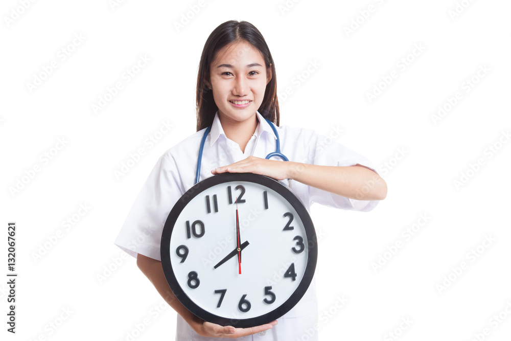 Young Asian female doctor happy show a clock. Young Asian female doctor happy show a clock.