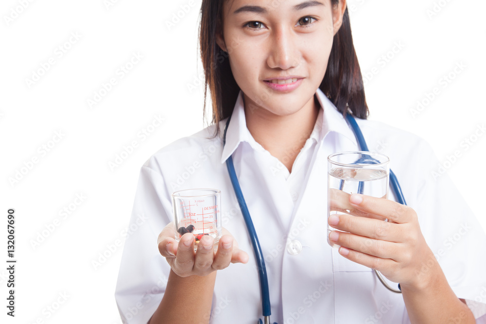 Young Asian female doctor with water and medicine. Young Asian female doctor with water and medicine.