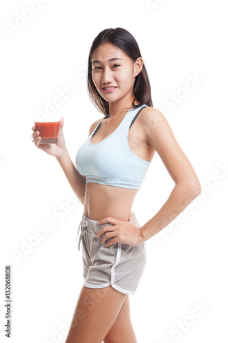 Beautiful healthy Asian girl with tomato juice. © halfbottle