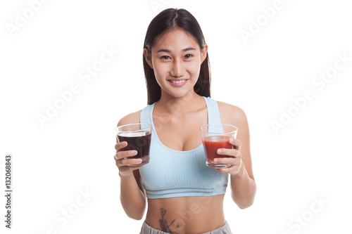 Beautiful healthy Asian girl with tomato juice and cola drinks.
