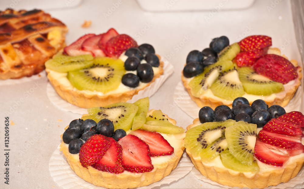 Organic fruit tarts displayed at a tropical open air farmers market Organic fruit tarts displayed at a tropical open air farmers market