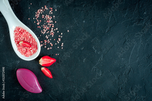 organic cosmetics with extracts of berries dark background top view