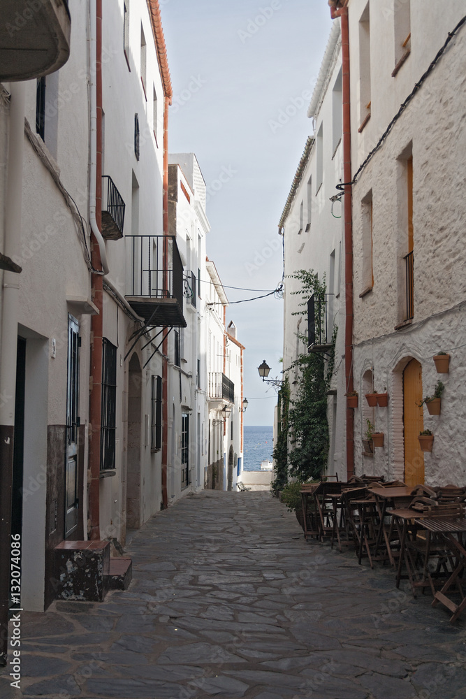 Narrow street in historical center of Cadaques, Cataluya, Spain