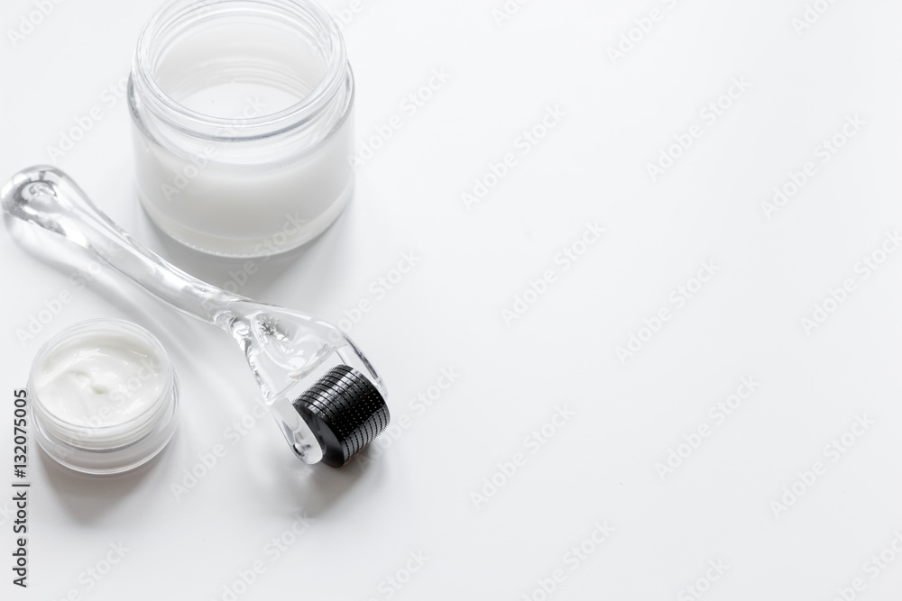 concept cosmetologist desktop with mezoroller - mesotherapy on white background concept cosmetologist desktop with mezoroller - mesotherapy on white background
